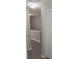 A hallway with light walls, light-colored floors, and white trim at 3336 Waldrop Trl, Decatur, GA 30034