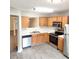 Well-maintained kitchen with light wood cabinets, stainless steel appliances, and open layout with lots of light at 3336 Waldrop Trl, Decatur, GA 30034