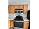 Updated kitchen with stainless steel appliances, light countertops, and wood cabinets at 3336 Waldrop Trl, Decatur, GA 30034