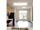 Sunlit kitchen area showcasing stainless steel appliances, wood cabinetry, and natural light with an eat-in nook at 3336 Waldrop Trl, Decatur, GA 30034