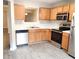 Functional kitchen with stainless steel appliances, wood cabinets, and a view to the dining room, with easy access at 3336 Waldrop Trl, Decatur, GA 30034
