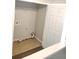 Compact laundry room with tile floor and connections for a washer and dryer at 3336 Waldrop Trl, Decatur, GA 30034