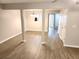 Open-concept living and dining area with modern flooring and neutral paint, filled with natural light at 3336 Waldrop Trl, Decatur, GA 30034