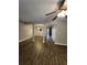 Open-concept living area features vinyl floors, a chandelier, and views into adjacent rooms at 3336 Waldrop Trl, Decatur, GA 30034