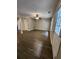 Spacious living room featuring vinyl plank flooring, a ceiling fan, and a neutral paint color at 3336 Waldrop Trl, Decatur, GA 30034