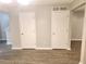 Bright open space with clean baseboards and floors, featuring white doors, offering flexibility for use at 3336 Waldrop Trl, Decatur, GA 30034