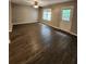 Open living area with vinyl floors and a view through the back door to the outdoor space at 3336 Waldrop Trl, Decatur, GA 30034