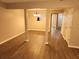 Open living space with hardwood floors, columns, a dining area, and doorways to other rooms at 3336 Waldrop Trl, Decatur, GA 30034