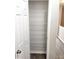 Walk-in pantry with metal wire shelving on the back of an open door at 3336 Waldrop Trl, Decatur, GA 30034