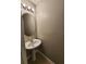 This powder room features a pedestal sink, oval mirror, and neutral paint at 3336 Waldrop Trl, Decatur, GA 30034