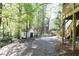 Backyard featuring a small outbuilding, patio and wooded views at 4175 Valley Trail Se Dr, Atlanta, GA 30339
