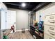 Finished basement with gray walls, wood-look floors and a white door at 4175 Valley Trail Se Dr, Atlanta, GA 30339
