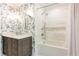Beautiful bathroom featuring floral wallpaper, white subway tile, and modern fixtures at 4175 Valley Trail Se Dr, Atlanta, GA 30339
