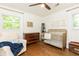 Charming Bedroom with brass crib, wood floors, and vintage dresser offering a warm and inviting space at 4175 Valley Trail Se Dr, Atlanta, GA 30339