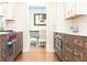 Gourmet kitchen featuring custom cabinetry, stainless steel appliances, and hardwood floors, opening to the dining area at 4175 Valley Trail Se Dr, Atlanta, GA 30339