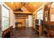 Versatile outbuilding featuring a wood paneled walls, desk, windows, and storage at 4175 Valley Trail Se Dr, Atlanta, GA 30339
