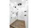 Luxurious walk-in shower with multiple shower heads, sleek glass enclosure, and elegant marble tiling at 4175 Valley Trail Se Dr, Atlanta, GA 30339