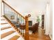 Elegant staircase with wooden treads and black iron railings, leading to the upper level of the house at 4175 Valley Trail Se Dr, Atlanta, GA 30339