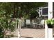 Cozy back deck with outdoor seating, surrounded by lush greenery and landscaping at 2029 Tuxedo Ne Ave, Atlanta, GA 30307