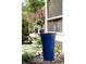 Picturesque backyard with a large planter box, decorative rocks, flowerbed, and various shrubbery at 2029 Tuxedo Ne Ave, Atlanta, GA 30307