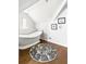 Bright bathroom features a freestanding tub, dark wood floors, and a round black and white area rug at 2029 Tuxedo Ne Ave, Atlanta, GA 30307