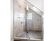 Bathroom features a glass shower enclosure with a pebble floor and tiled walls at 2029 Tuxedo Ne Ave, Atlanta, GA 30307