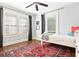 Cozy bedroom with hardwood floors, natural light, and a ceiling fan at 2029 Tuxedo Ne Ave, Atlanta, GA 30307