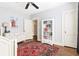 Bright bedroom with hardwood floors, natural light, and dresser at 2029 Tuxedo Ne Ave, Atlanta, GA 30307