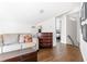 Cozy bonus room featuring wood floors, a comfortable couch, and natural light at 2029 Tuxedo Ne Ave, Atlanta, GA 30307