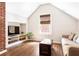 Bonus room with hardwood floors, a sofa, and built in shelving storage at 2029 Tuxedo Ne Ave, Atlanta, GA 30307