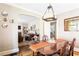 Open concept dining room with hardwood floors and view to living room at 2029 Tuxedo Ne Ave, Atlanta, GA 30307