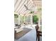 Comfortable screened patio featuring a ceiling fan, outdoor seating, and a scenic view at 2029 Tuxedo Ne Ave, Atlanta, GA 30307