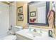 Bathroom featuring white tiled shower-tub combo and vanity with decorative accents at 2602 White Aster Ln, Dacula, GA 30019