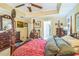 Cozy bedroom featuring a wooden bed frame, dresser, and natural light at 2602 White Aster Ln, Dacula, GA 30019