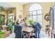 This dining room features a large window and chandelier, creating an elegant atmosphere at 2602 White Aster Ln, Dacula, GA 30019