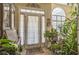 Inviting foyer featuring tiled floors, natural light, and decorative plants at 2602 White Aster Ln, Dacula, GA 30019
