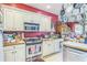 Functional kitchen with white cabinetry, stainless steel appliances, and a gas range at 2602 White Aster Ln, Dacula, GA 30019
