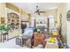 Cluttered living room featuring a fireplace, built-in shelving, and neutral-toned walls at 2602 White Aster Ln, Dacula, GA 30019