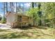 A house featuring a wooden deck and a lush, tree-filled backyard at 2650 Gwendon Ct, Decatur, GA 30034
