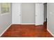 Bedroom featuring hardwood floors, neutral walls, a window, and access to nearby closets at 2650 Gwendon Ct, Decatur, GA 30034