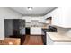 Well-maintained kitchen with white cabinetry, black appliances, and efficient layout at 2650 Gwendon Ct, Decatur, GA 30034