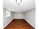 A spacious room with sleek hardwood floors and a window that fills the space with natural light at 2650 Gwendon Ct, Decatur, GA 30034