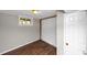 A bright room featuring hardwood floors, a window and door leading to the rest of the basement at 2650 Gwendon Ct, Decatur, GA 30034