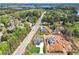 Aerial view of the neighborhood, showcasing multiple new construction homes, lush greenery, and a glimpse of the lake in the distance at 1095 Lanier Pl, Cumming, GA 30041