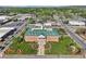 Aerial view of a large brick building with well-manicured landscaping and surrounding roadways at 1095 Lanier Pl, Cumming, GA 30041