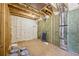 Unfinished basement features insulation and exposed wood framing at 1095 Lanier Pl, Cumming, GA 30041