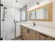 Bathroom features white countertops, sleek cabinets, and glass-enclosed shower with hexagon tile at 1095 Lanier Pl, Cumming, GA 30041