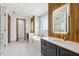 Modern bathroom with wood accent wall, a soaking tub, and dual vanities at 1095 Lanier Pl, Cumming, GA 30041