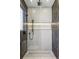 Modern shower featuring hexagon tile surround and black shower head and fixtures at 1095 Lanier Pl, Cumming, GA 30041