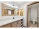 Modern bathroom featuring a vanity with solid surface countertop and access to the shower and toilet area at 1095 Lanier Pl, Cumming, GA 30041